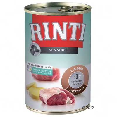 RINTI Sensible Lamm Kartoffel, puszka z widocznym mięsem i ziemniakami, napis: Für empfindliche Hunde, Neue Rezeptur, Nr. 1 tierisches Protein.