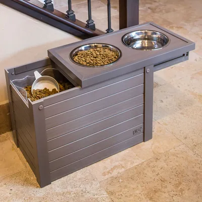 Feeding station with two stainless steel bowls and integrated dry food container, grey wood design.
