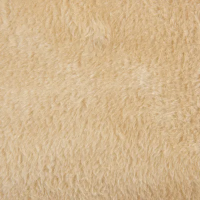 Close-up of beige, fluffy fabric material. Suitable for describing the texture or material of a product.