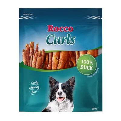 Rocco Curls, 100% pato, 200g. Envase con snacks para perros retorcidos y un Border Collie representado. Texto: 'Curly chewing fun!'