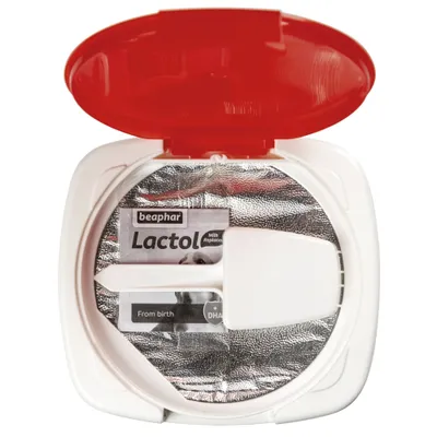 Open container showing beaphar Lactol milk replacer with scoop inside. Visible text: 'From birth' and '+ DHA'.