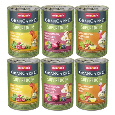 animonda GranCarno Superfoods: Huhn mit Spinat, Himbeeren, Kürbiskerne; Rind mit Rote Bete, Brombeeren, Löwenzahn; Pute mit Mangold, Hagebutten, Leinöl. 6 Dosen abgebildet.