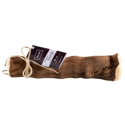 Chewies wooden dog chew with label attached by string, visible text: Chewies, Wurzelholz für Hunde, L. Large size indicated on tag.