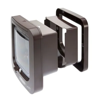 Brown plastic pet door with tunnel extension, showing front flap and modular parts for wall installation.