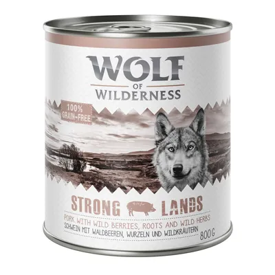 Wolf of Wilderness Strong Lands -purkki, 100 % grain-free, porsasta, villimarjoja, juuria ja villiyrttejä. Paino 800 g. Englanninkielinen tuotekuvaus näkyvissä etiketissä.