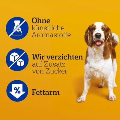 Tekst na njemačkom: Ohne künstliche Aromastoffe, Wir verzichten auf Zusatz von Zucker, Fettarm. Slika psa na žutoj pozadini.