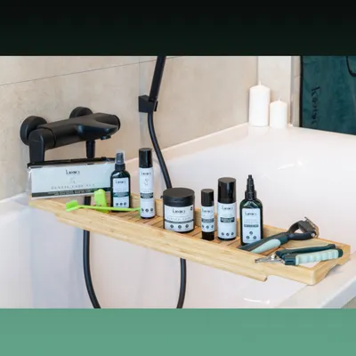 kooa Dental Care Set and care products for pets on bamboo tray, including toothbrush, clipper and sprays.