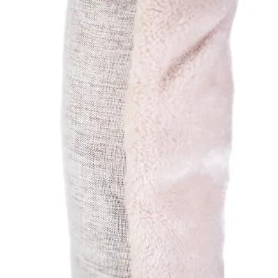 Close-up of a product with two materials: grey fabric on the left, soft pink plush on the right.
