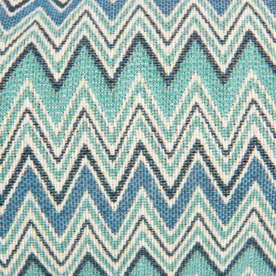 Stof met zigzagpatroon in blauw, groen en wit. Materiaal: textiel. Detailopname van het oppervlak, geen merknaam of productinformatie zichtbaar.