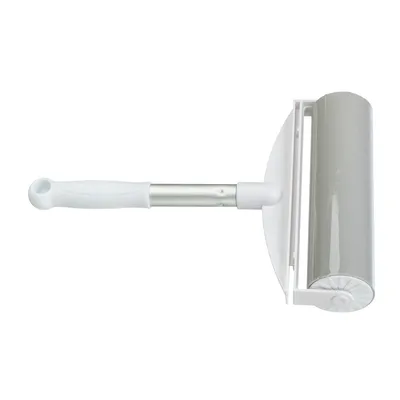 Lint roller with white handle and grey adhesive roll, suitable for removing pet hair and dust.