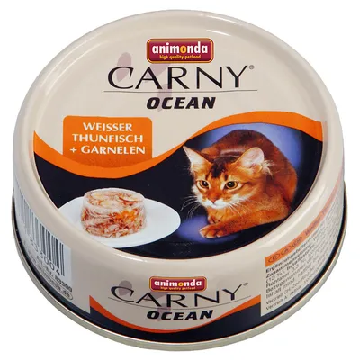 Scatoletta Animonda Carny Ocean per gatti, testo visibile: WEISSER THUNFISCH + GARNELEN, immagine di gatto e porzione di cibo su piatto.
