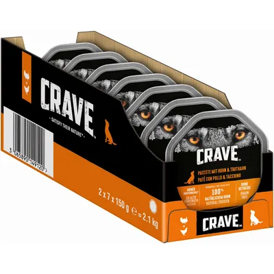 CRAVE pastete mit huhn & truthahn, 2 x 7 x 150 g, yhteensä 2,1 kg. Ilman viljaa. 100 % luonnollinen kana. Useita annospakkauksia mustassa ja oranssissa laatikossa.