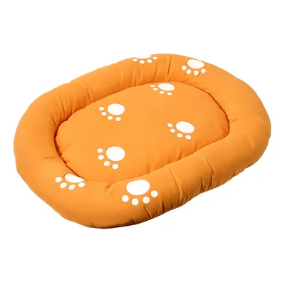 Orange oval cushion with white paw prints, suitable as a lying surface.