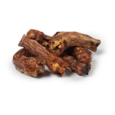 Dried meat pieces, likely poultry necks, as a natural snack for pets.