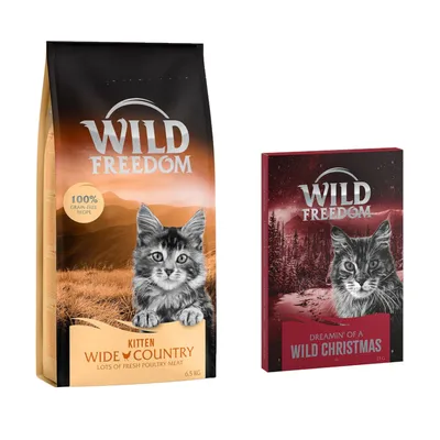 Balení Wild Freedom Kitten Wide Country 6,5 kg s textem '100% grain-free recipe' a krabička Wild Freedom Dreamin' of a Wild Christmas 18 g, obě s obrázkem kotěte.