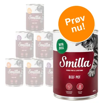 Smilla Beef Pot dåsefoder 400 g med teksten 'WITH DUCK', 'CONTAINS TAURINE', 'GRAIN-FREE' og orange mærke med 'Prøv nu!'. Flere varianter vises i baggrunden.