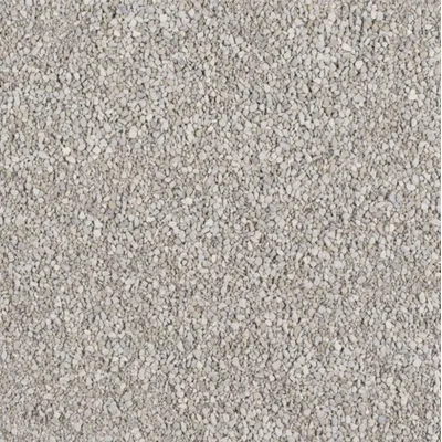 Vista ravvicinata di lettiera per gatti composta da piccoli granuli grigi, materiale non specificato visibile.