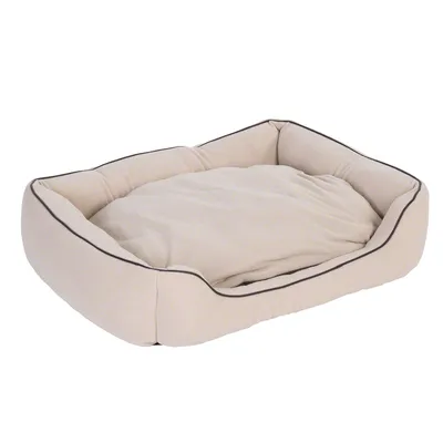 Cama rectangular beige para mascotas con bordes elevados y cojín interior acolchado, material textil visible.