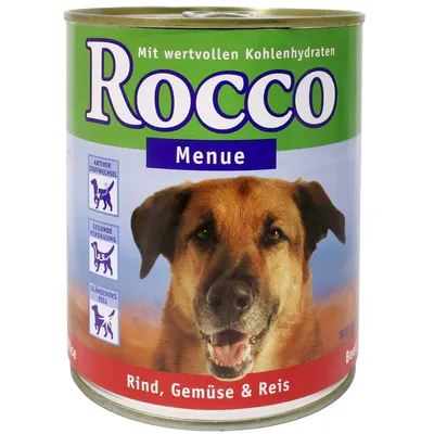 Blik Rocco Menue hondenvoer, tekst: 'Mit wertvollen Kohlenhydraten', 'Rind, Gemüse & Reis'. Pictogrammen: aktiver Stoffwechsel, gesunde Verdauung, glänzendes Fell. Inhoud 800 g.