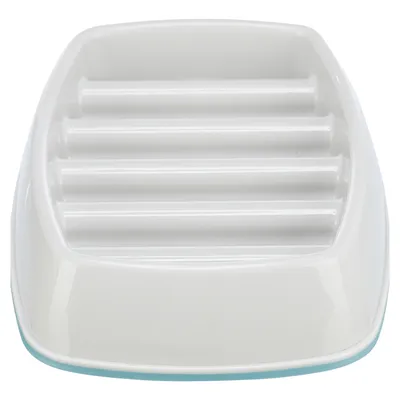 White feeding bowl with ribbed design for slow food intake.