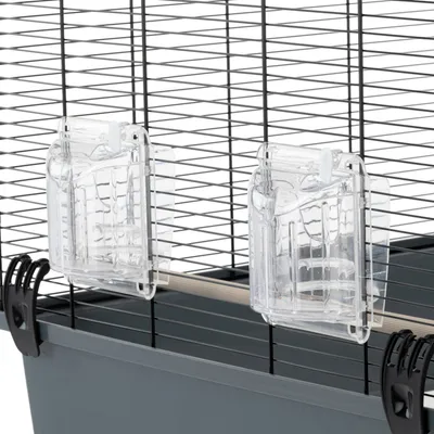 Two transparent plastic feeders attached to the side of a wire cage, showing how they are mounted for easy access inside the enclosure.