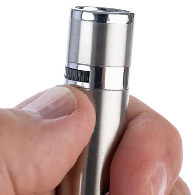 Close-up of a hand holding an adjustable metal handle with a knurled adjustment wheel.