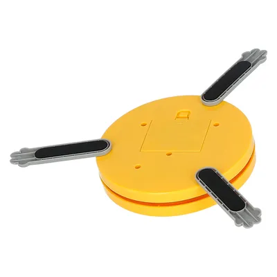 Yellow round toy with three grey arms and black rubber surfaces, suitable for interactive play.