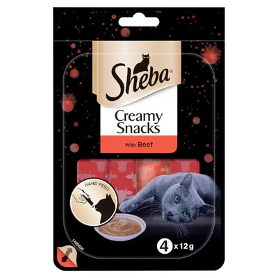 Sheba Creamy Snacks with Beef, 4 x 12g. Visible text: Hand Feed. Image shows cat and creamy snack in bowl on front of packaging.