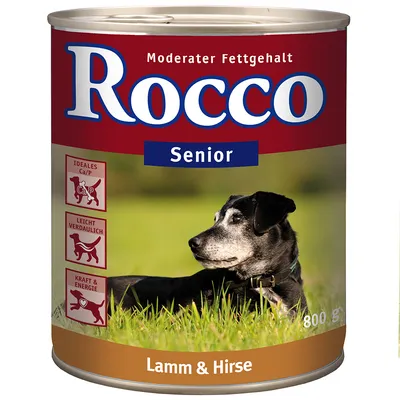 Boîte de nourriture pour chien Rocco Senior, texte visible : Moderater Fettgehalt, Lamm & Hirse, 800 g. Icônes : Idéales Ca/P, Leicht verdaulich, Kraft & Energie. Photo d’un chien noir et gris.