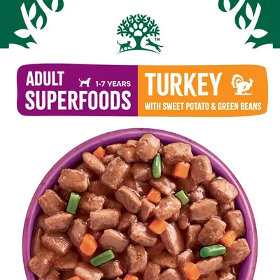 Adult superfoods, 1-7 years. Turkey with sweet potato and green beans. Image shows chunks of food in gravy with visible pieces of green beans and orange vegetables.