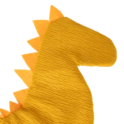 Yellow fabric toy in the shape of a dinosaur with orange spikes on its back.