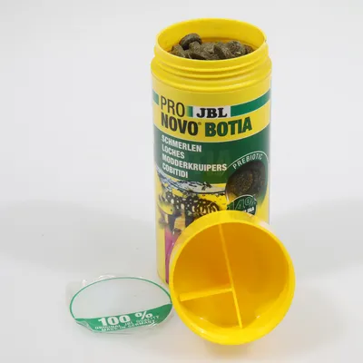 JBL Pro Novo Botia, food for loaches, mudfish and cobitids. Prebiotic, 100% Made in Germany, yellow container with open lid showing the food.