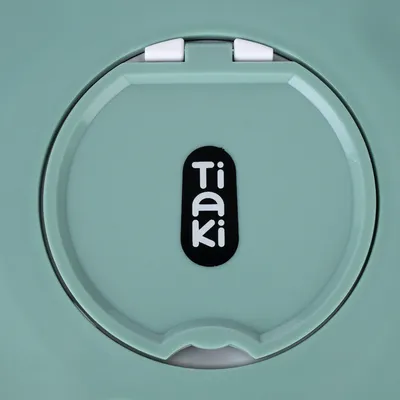 Tiaki. Brand name on green product lid with white closure.