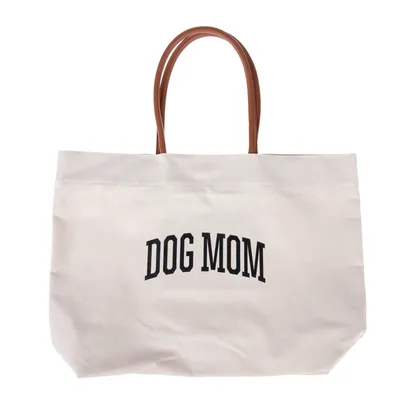 Bolsa de tela blanca con asas marrones y estampado negro 'DOG MOM'.