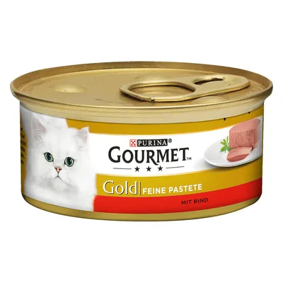 Purina Gourmet Gold нежный паштет с говядиной, банка с золотистой крышкой, изображение белой кошки и поданная паста.