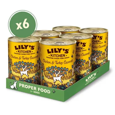 Six cans of Lily's Kitchen Chicken & Turkey Casserole proper food for dogs, shown in a green tray with x6 quantity label.