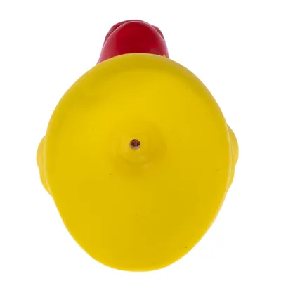 Yellow and red plastic toy in a round shape, top view.