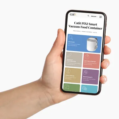 Smartphone screen displays Catit PIXI Smart Vacuum Food Container with options: Discover, Product Registration, Getting Started, Tips & Tricks, Maintenance.