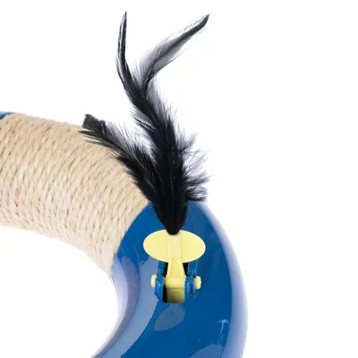 Toy ring made of blue plastic with sisal rope and yellow clip holding a black feather.