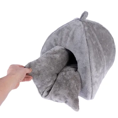 Grey, soft pet bed with removable cushion filling. Hand demonstrates the removable cushion function.