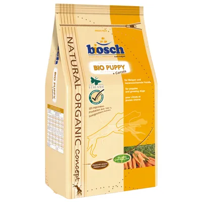 Sac de croquettes bosch BIO PUPPY + Carrots, Natural Organic Concept, pour chiots et jeunes chiens, certification ECOLAND, visuel de carottes, texte en anglais, allemand et français visible.