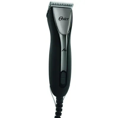 Oster A6 electric pet hair clipper with black and silver design, visible cable connection.