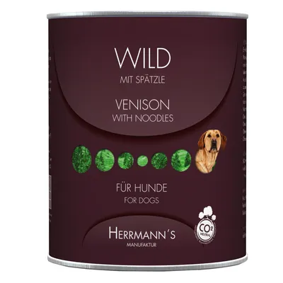 Herrmann's Manufaktur dåse med teksten: Wild mit Spätzle, Venison with Noodles, für Hunde, for dogs, CO2 neutral. Billede af hund og grønne cirkler på etiketten.