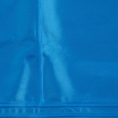 Close-up of blue textured material, showing stitching and fabric detail.