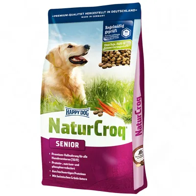 Happy Dog NaturCroq Senior kutyatáp csomagolás, látható: sárga kutya, zöld fű, répa, feliratok: 'Ohne Soja, Farb- & Konservierungsstoffe!', 'Regelmäßig geprüft', 'SENIOR'.