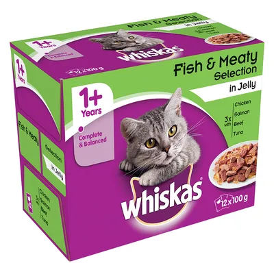 Whiskas Fish & Meaty Selection in Jelly, 12×100 g, pro kočky 1+ let. Kuře, losos, hovězí, tuňák. Complete & Balanced. Fialovo-zelené balení s obrázkem kočky a porcí krmiva.