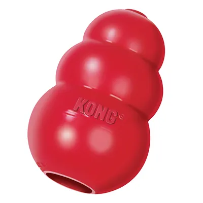 Giocattolo KONG rosso in materiale resistente con logo KONG in rilievo, adatto per essere riempito tramite apertura inferiore.