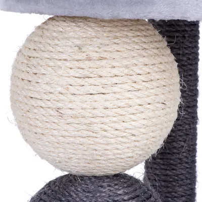 Cat tree element made of light sisal rope, round design, with grey sisal posts in the background.