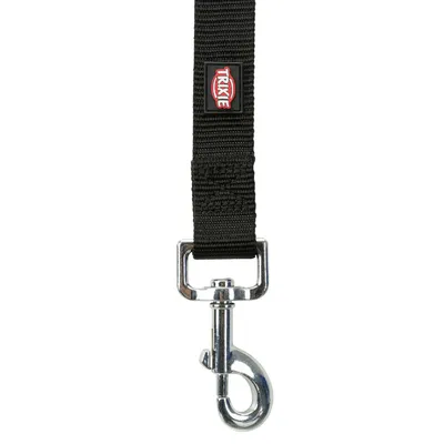Black dog lead with metal snap hook and Trixie logo on the strap.