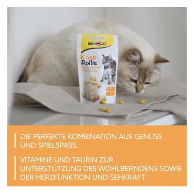 GimCat Käse Rollis, sachet de friandises pour chat avec morceaux jaunes visibles. Texte en allemand : vitamines et taurine pour le bien-être, la fonction cardiaque et la vue.